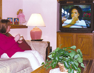 Hagerstown, MD, <I>Oprah Winfrey Show </I>viewer and mother of four Liz Kuharski, 34, awaits word from her leader about what to buy, cook and read.